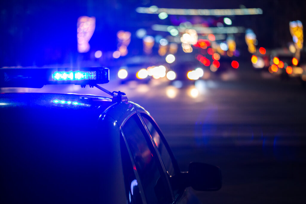 police car lights at night in city